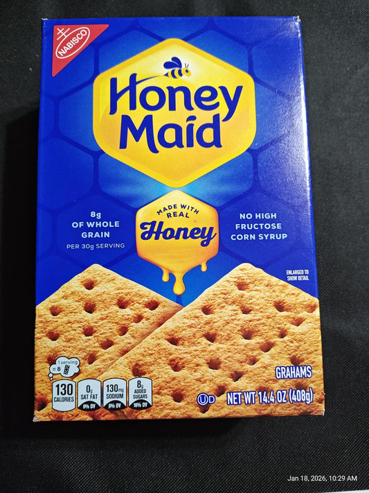 Honey Maid Honey graham crackers box featuring whole grain and real honey.