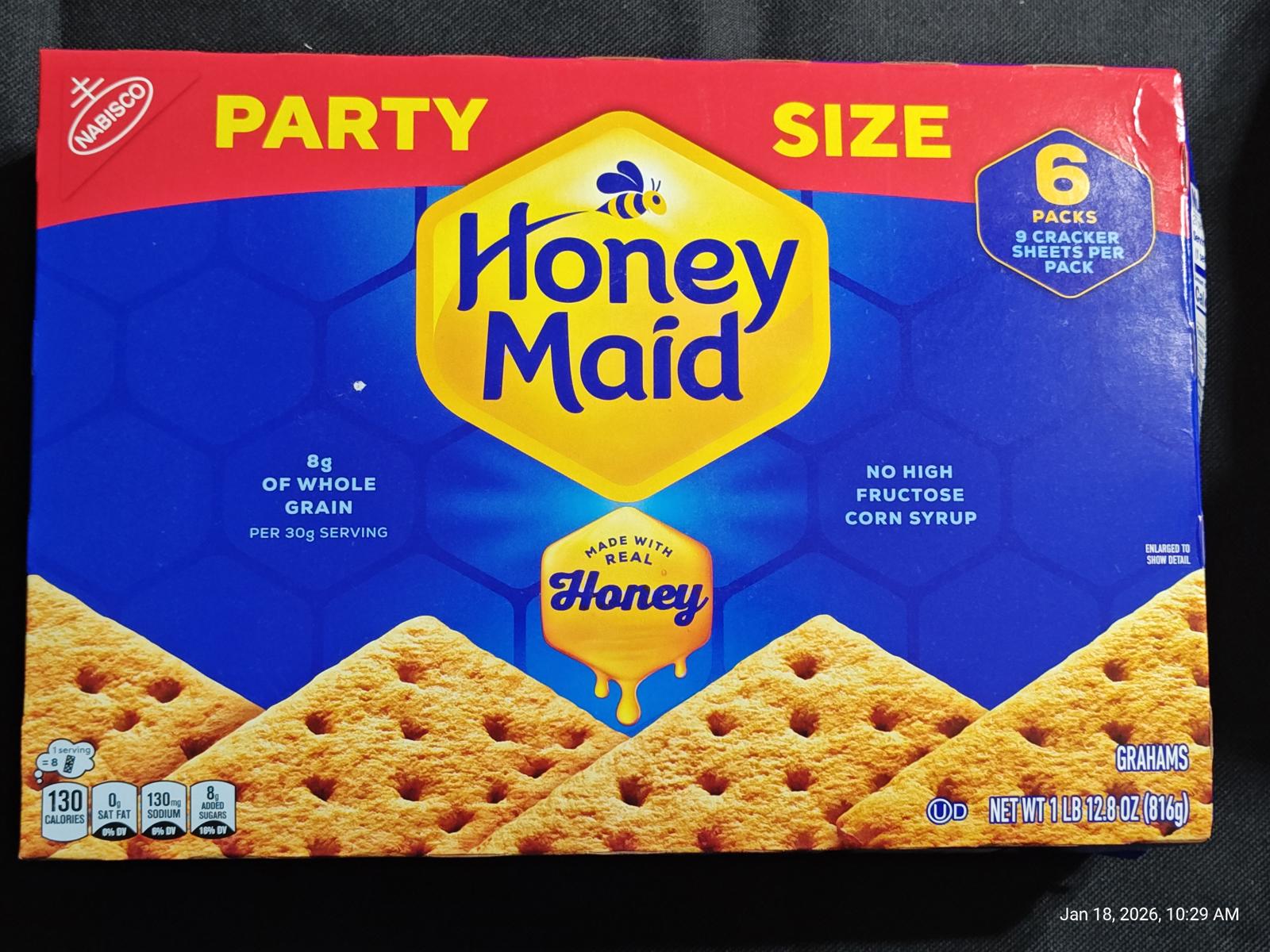 Honey Maid party size graham crackers box featuring six packages, made with whole grain.