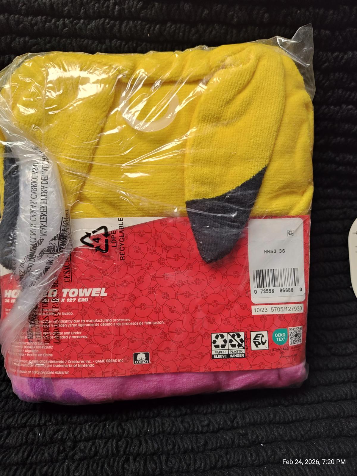 Hooded towel featuring a bright yellow design with playful accents for kids.