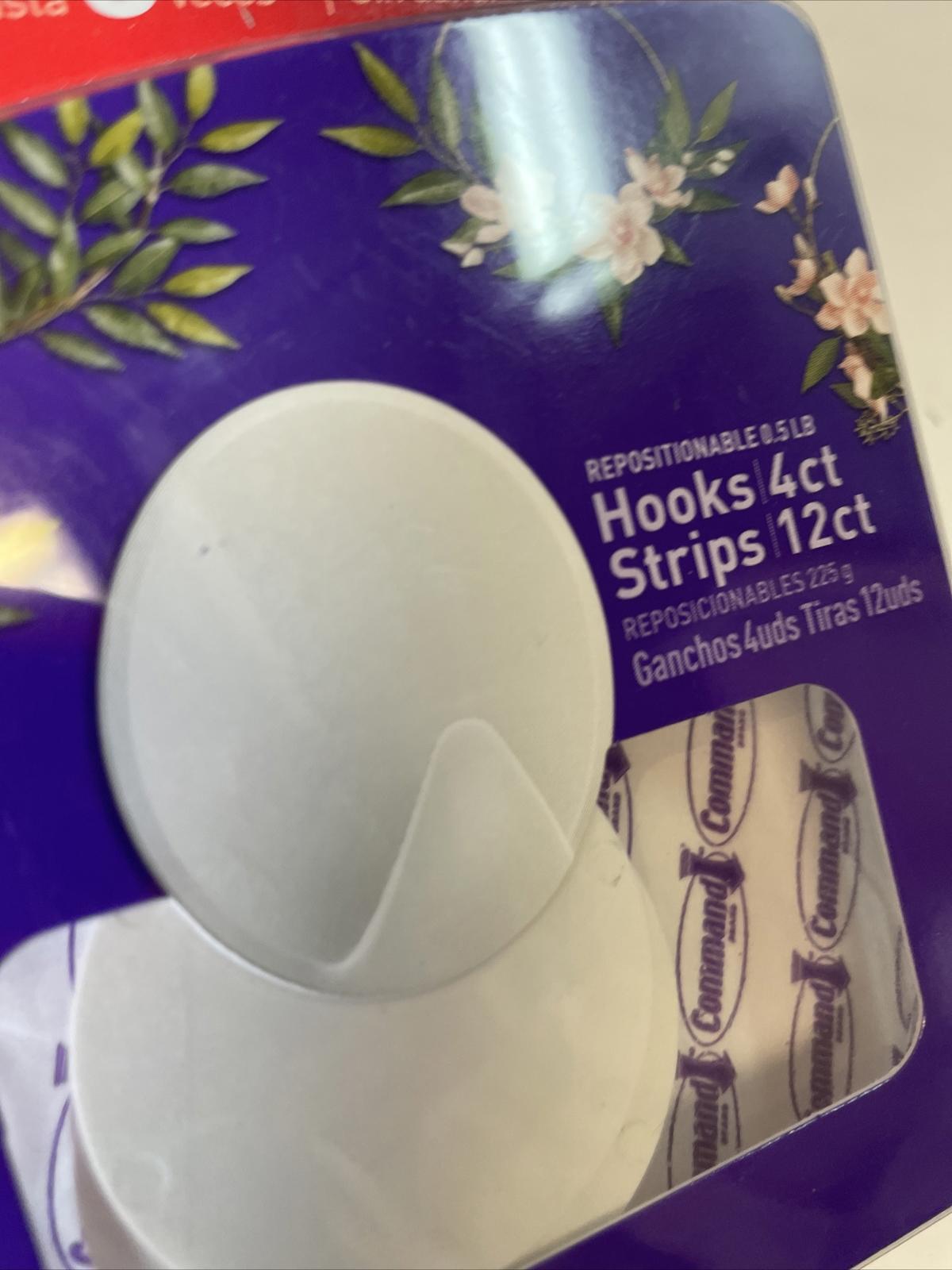 Hooks 4ct strips 12ct pack featuring repositionable adhesive for easy mounting.