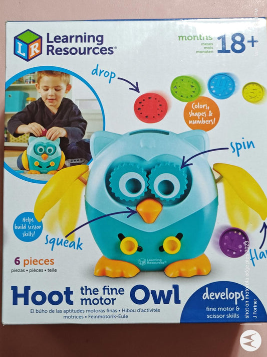 Hoot the Fine Motor Owl toy by Learning Resources features colorful buttons for spinning and squeaking.