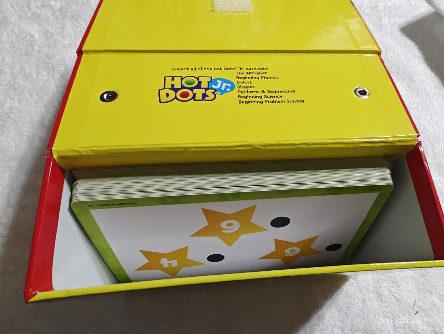 Hot Dots learning cards in a bright yellow box, featuring star designs and numbers.