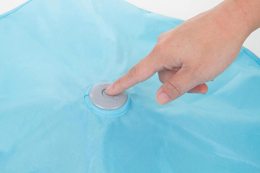 Inflatable Pool Float with a hand pressing the valve in blue color.