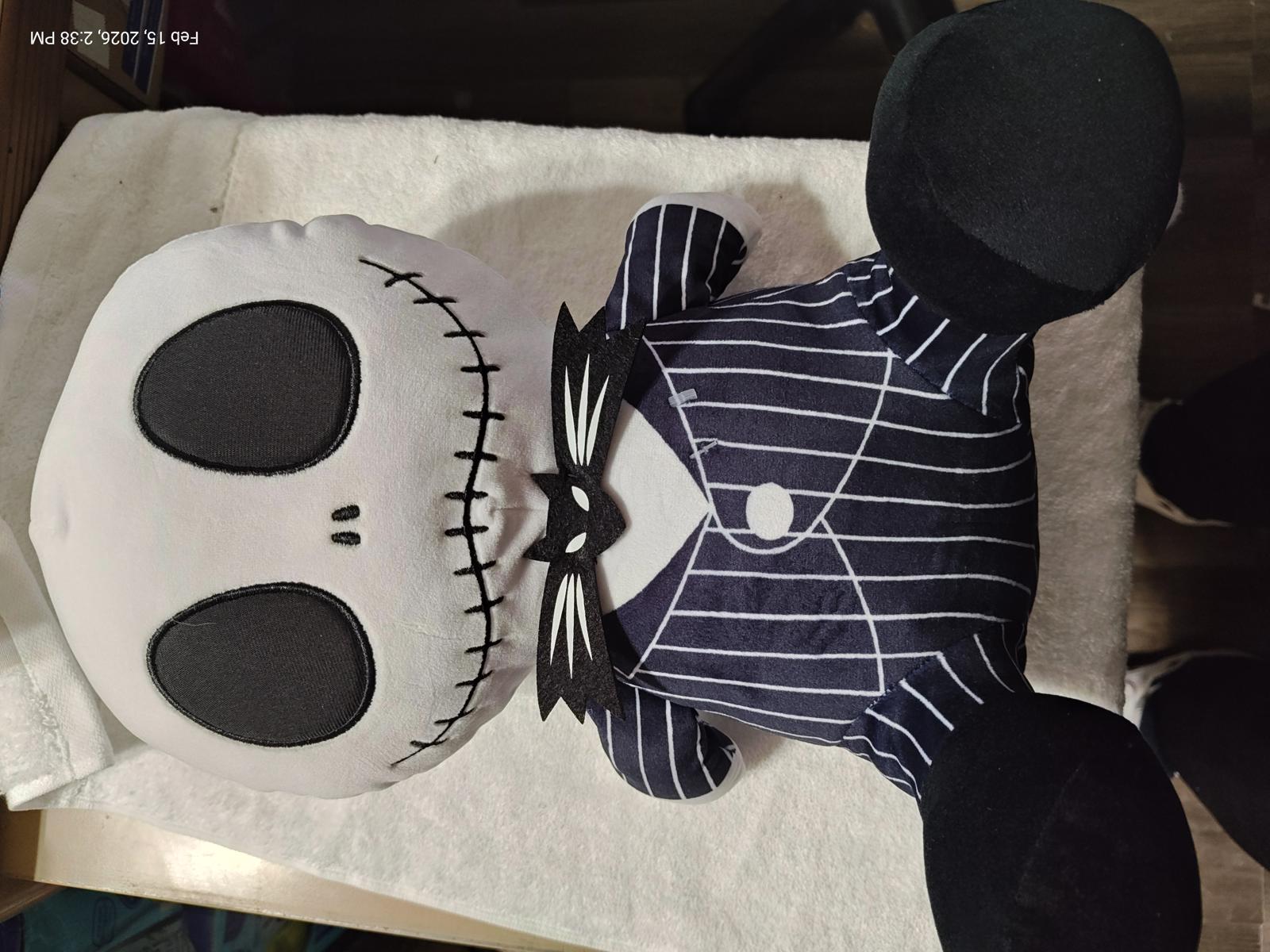 Jack Skellington plush toy with pinstripe suit and large skull face.