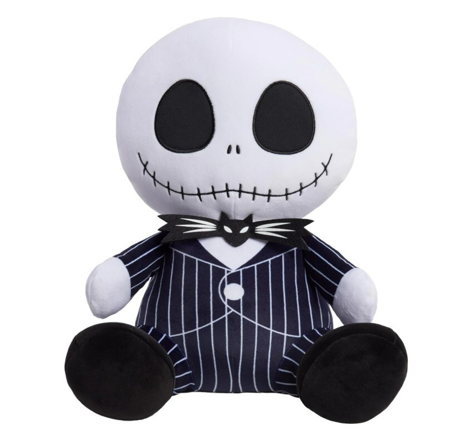 Jack Skellington plush toy with black and white striped suit and large round head.