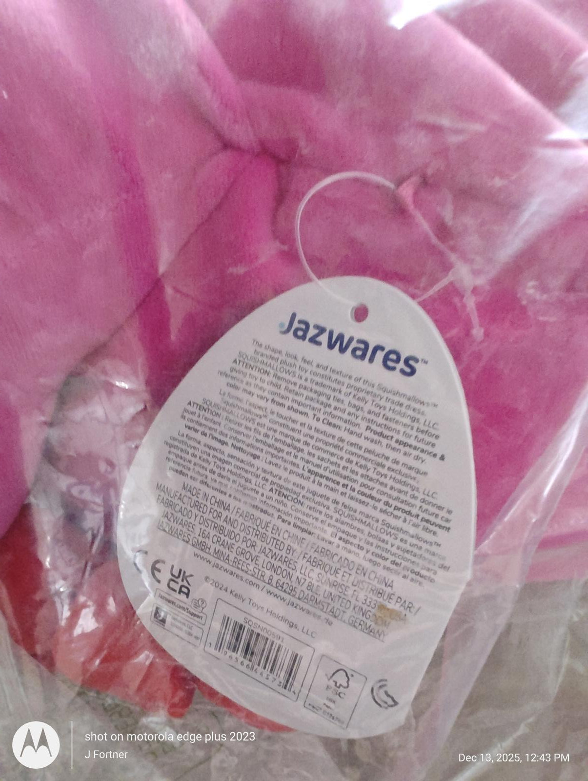 Jazwares plush toy in pink color with tag details visible.