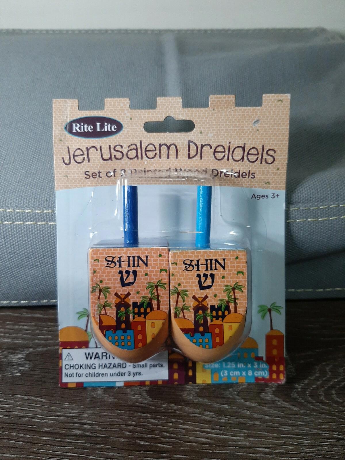 Jerusalem Dreidels set featuring colorful designs and blue handles, perfect for Hanukkah celebrations.