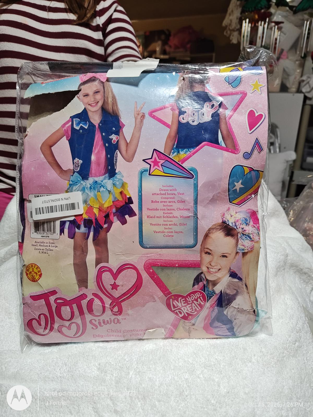 JoJo Siwa costume set featuring a colorful skirt and denim vest with accessories.