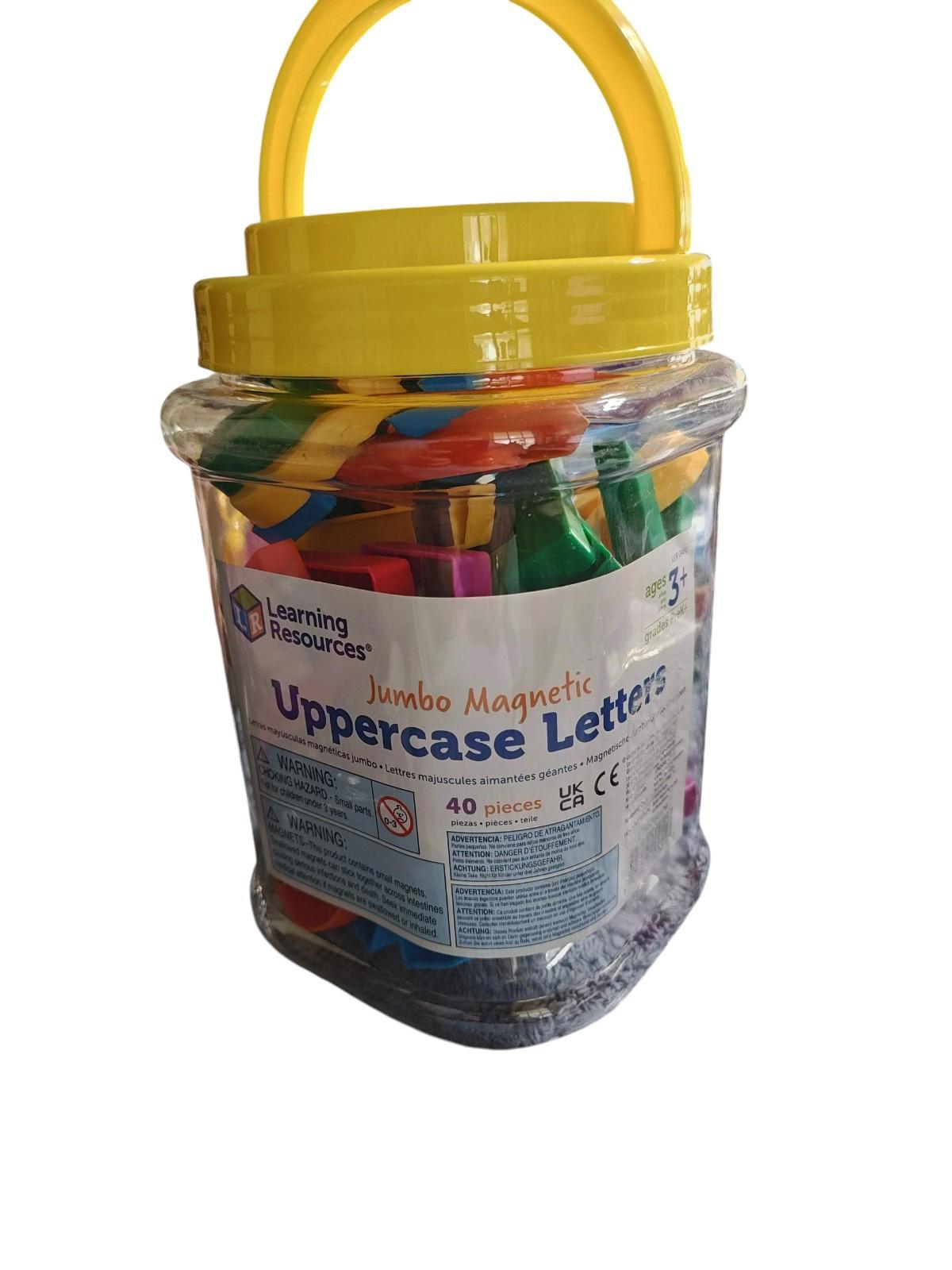 Learning Resources Jumbo Magnetic Uppercase Letters in a clear storage container with a yellow lid.