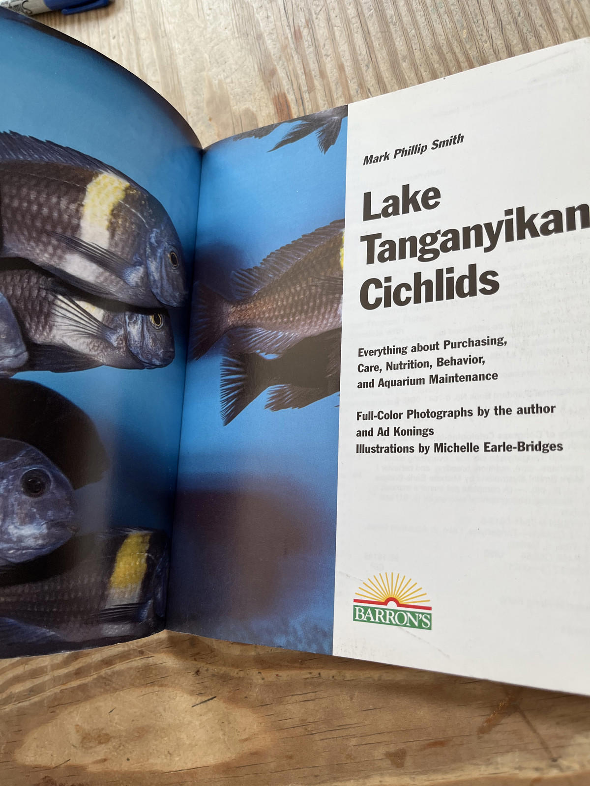 Lake Tanganyikan Cichlids book featuring full-color photographs and care tips for fish enthusiasts.