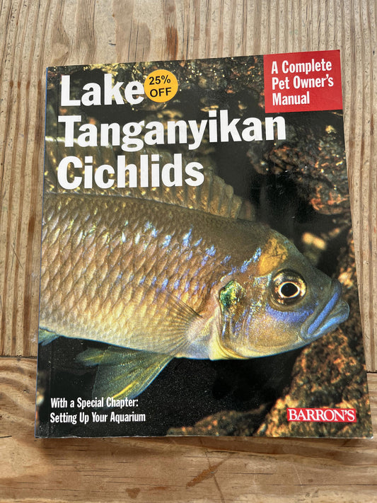 Lake Tanganyikan Cichlids book cover featuring a colorful fish and aquarium setup tips.