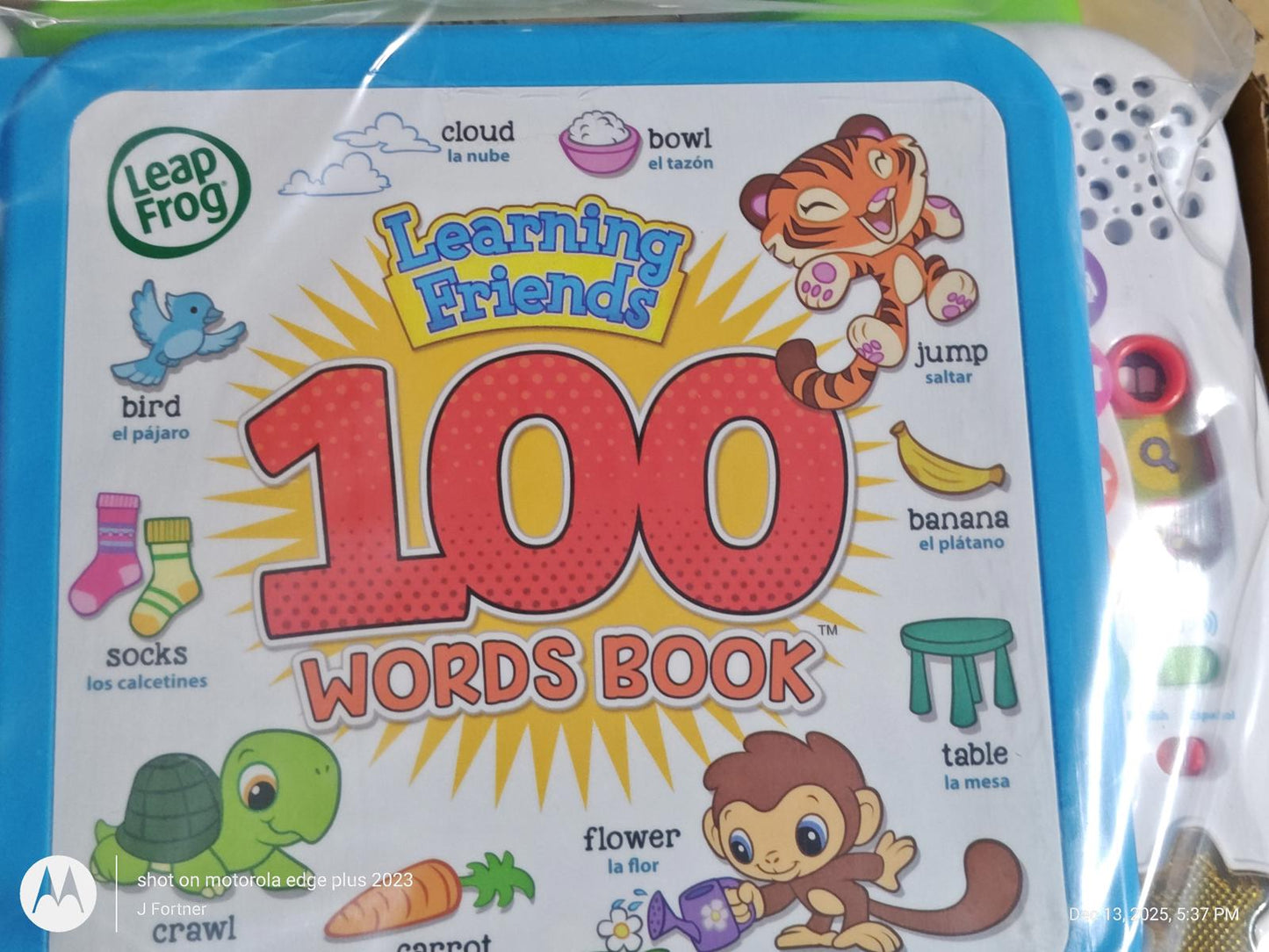 Leap Frog Learning Friends 100 Words Book featuring colorful illustrations and interactive elements.