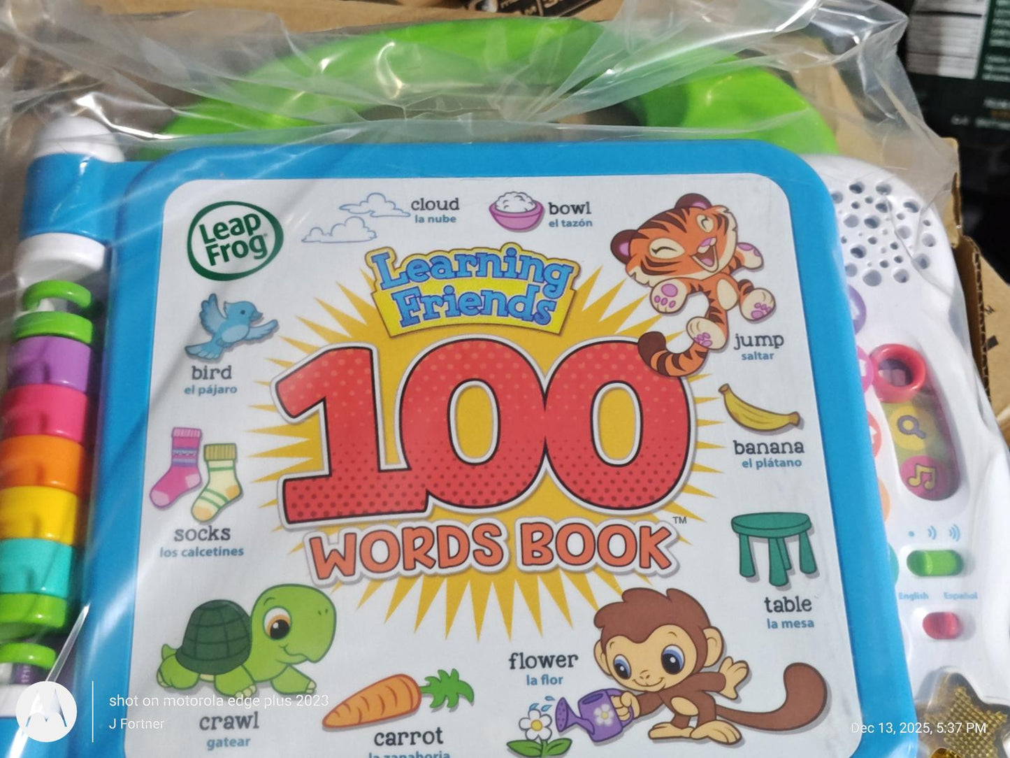 Learning Friends 100 Words Book featuring colorful illustrations and interactive buttons.