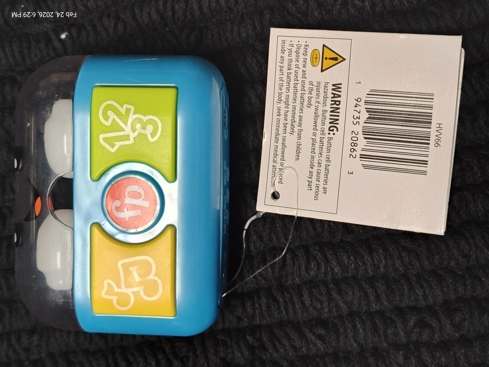 Learning Toy with colorful buttons and a clear casing for interactive play.