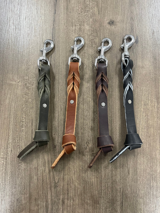 Leather Keychain Set featuring braided designs in brown, black, green, and tan colors.
