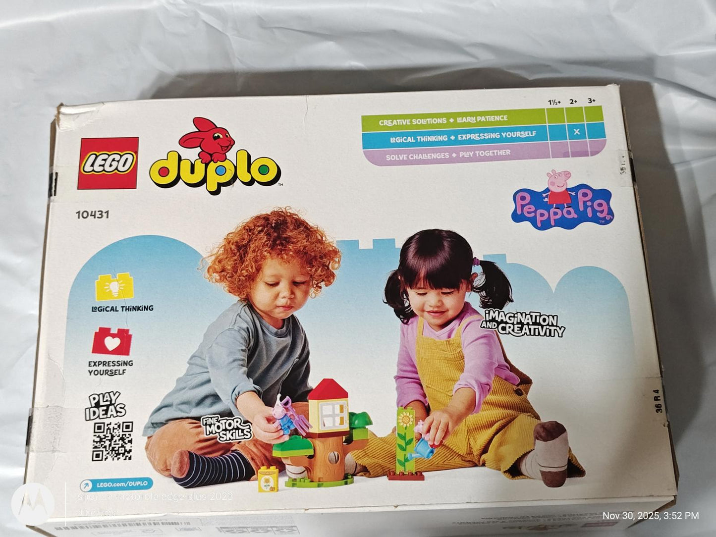 LEGO Duplo Peppa Pig set featuring children playing with colorful building blocks.