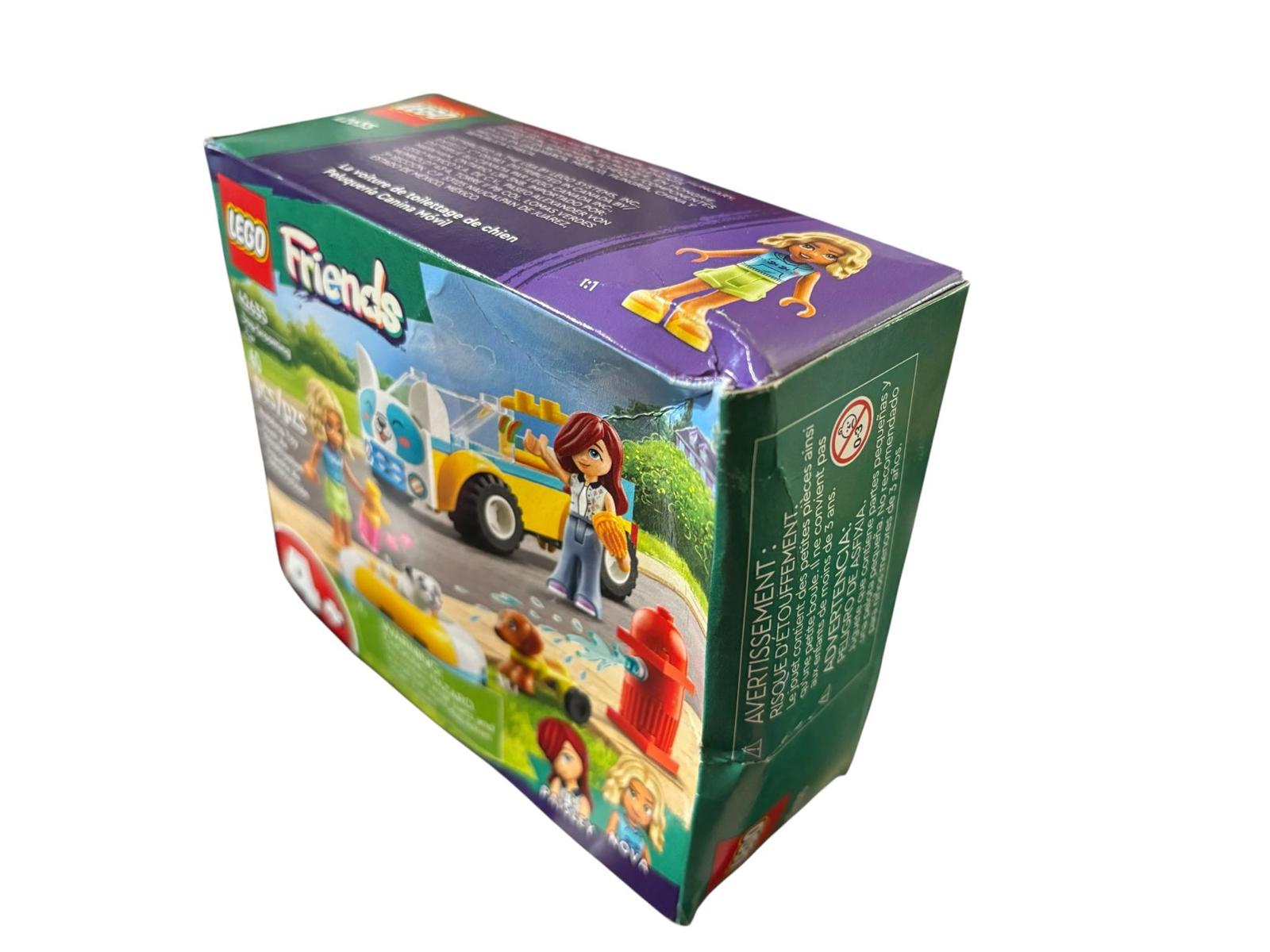 LEGO Friends set featuring a colorful box with characters and a vehicle scene.