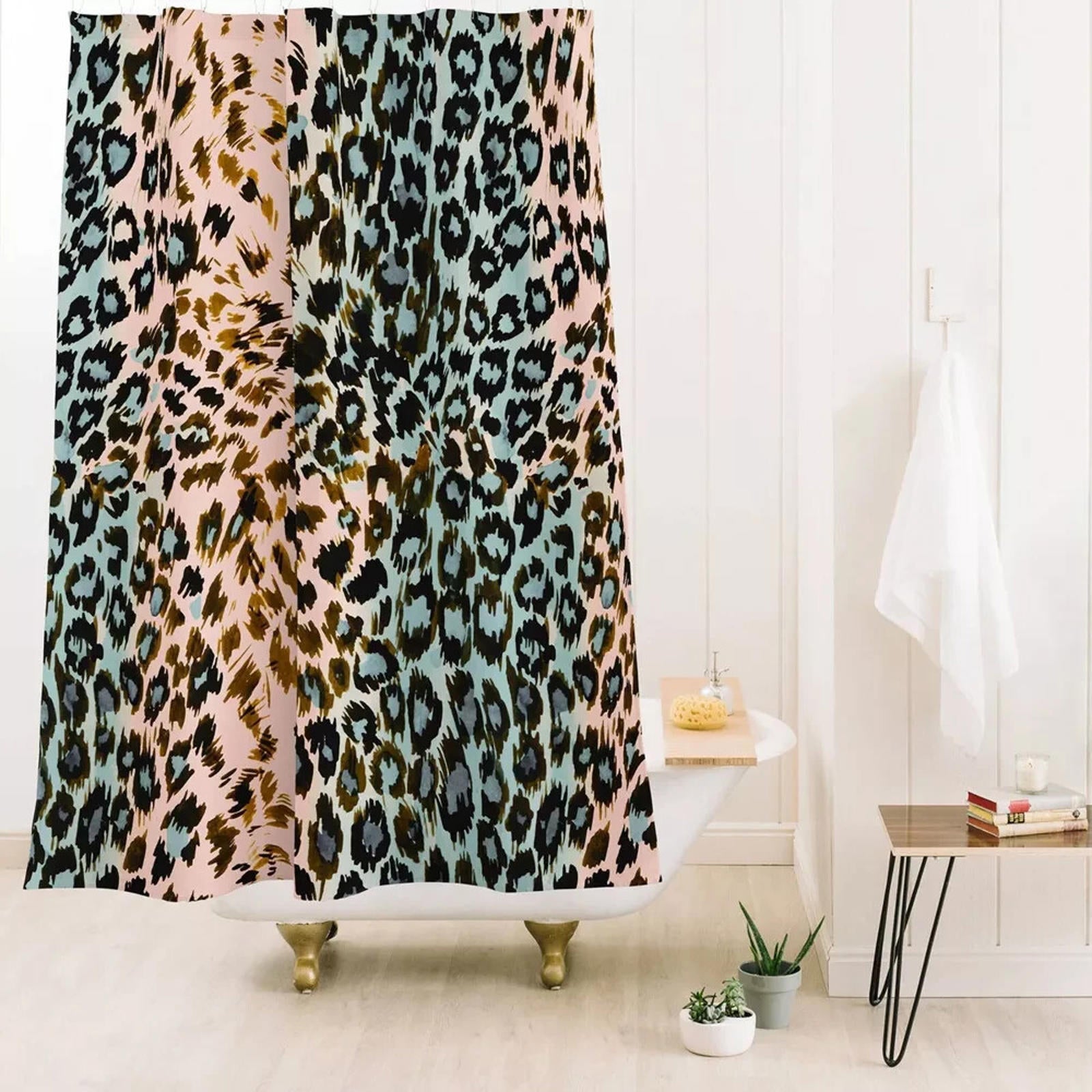 Leopard Print Shower Curtain featuring a vibrant mix of pink, blue, and brown colors.
