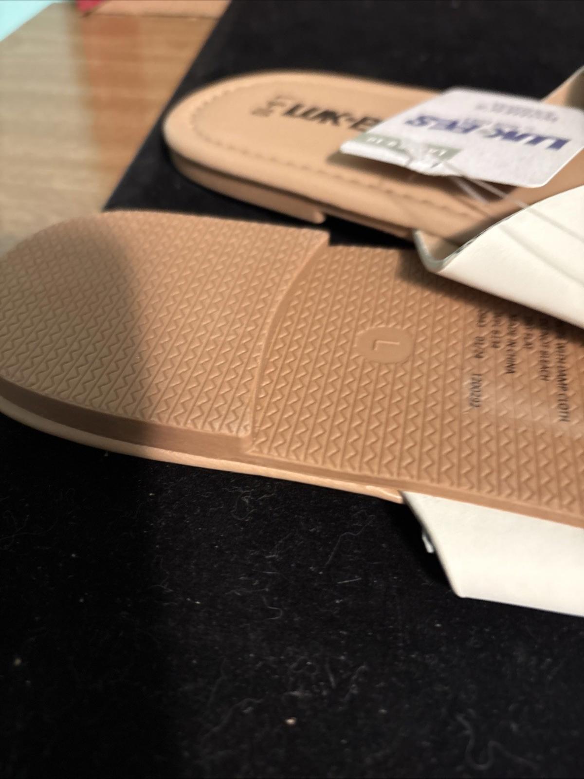 Lifestride sandals featuring a textured sole and a stylish design.