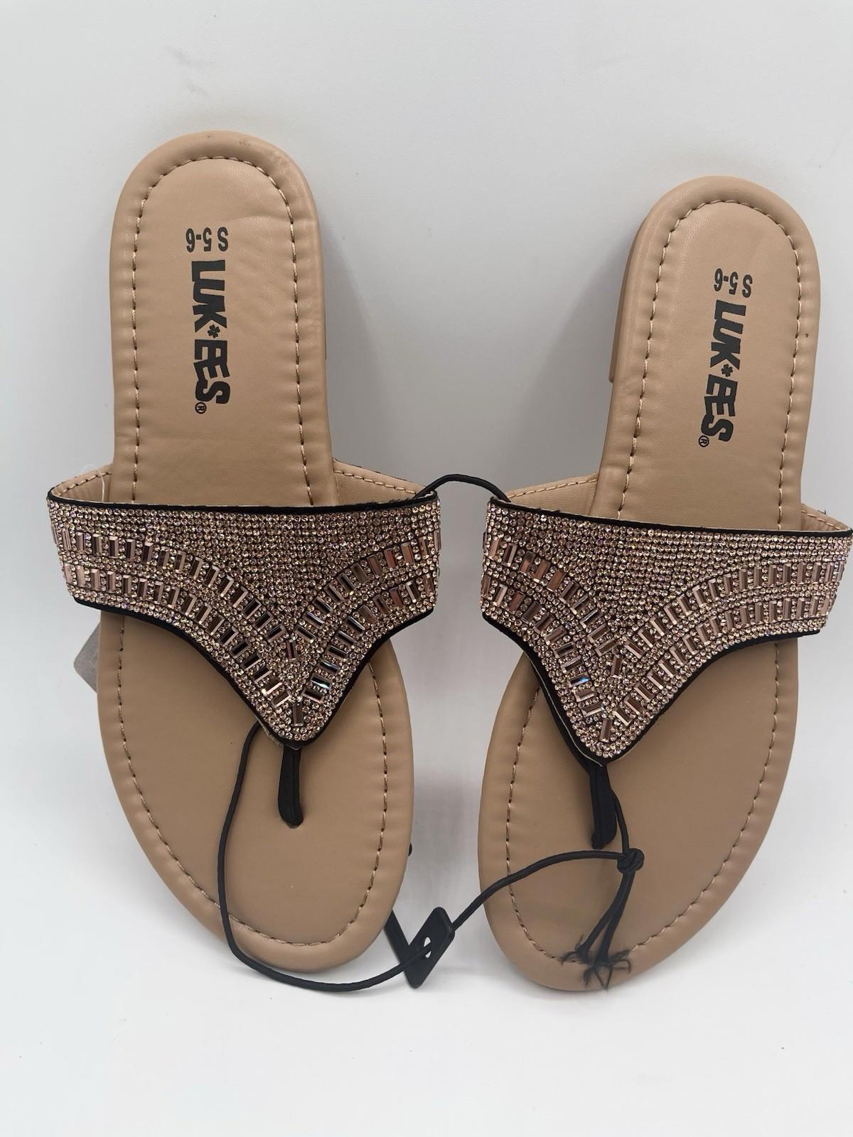 LIKES. embellished sandals featuring a stylish design with rhinestones and a comfortable sole.
