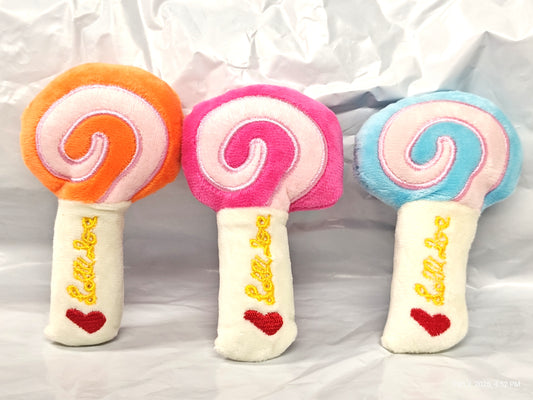 Lollipop plush toy set featuring three colorful designs in orange, pink, and blue.