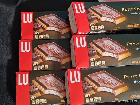 LU Petit Écolier chocolate biscuits stacked in packaging.