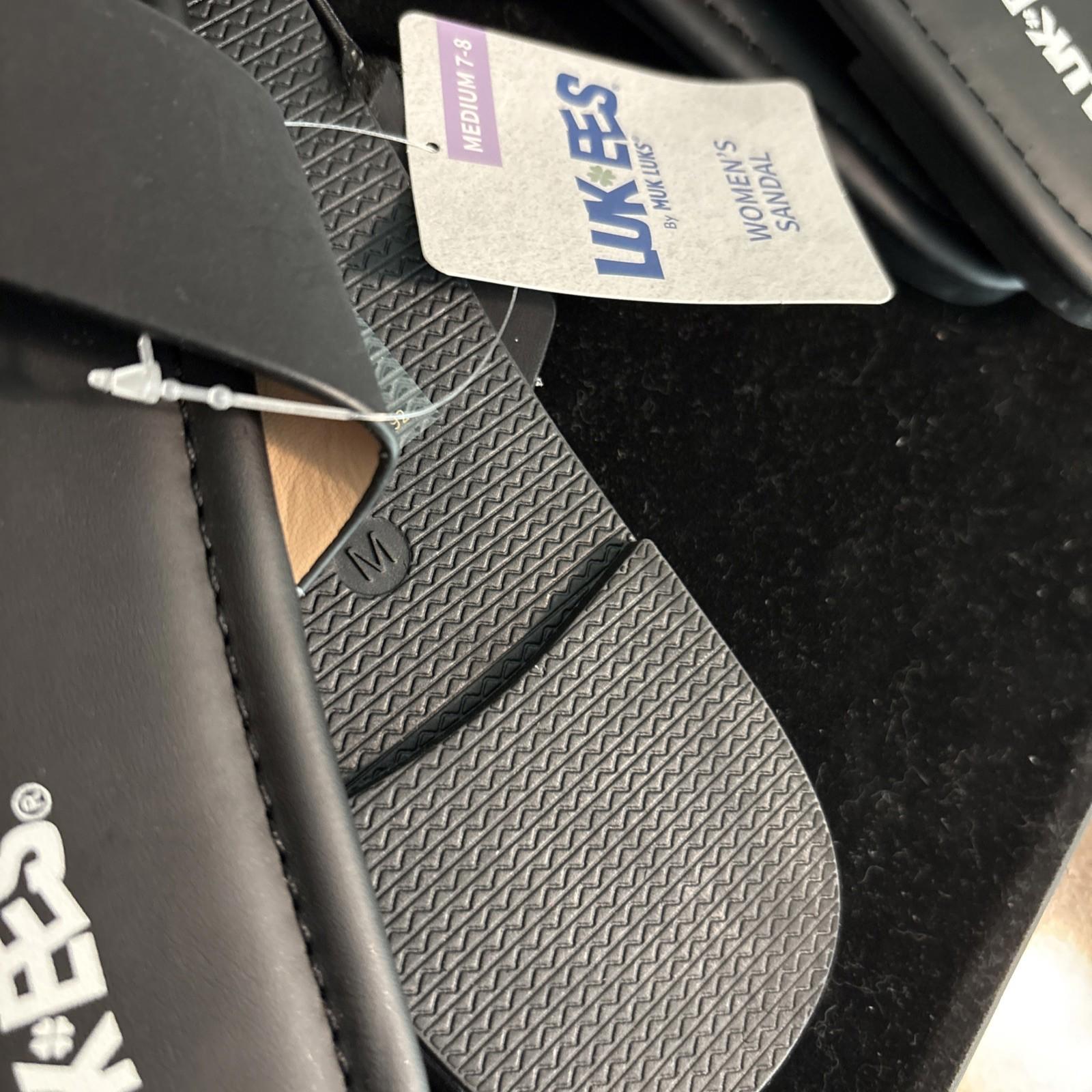 Lukees flip flops featuring a textured sole and a black strap for comfort.