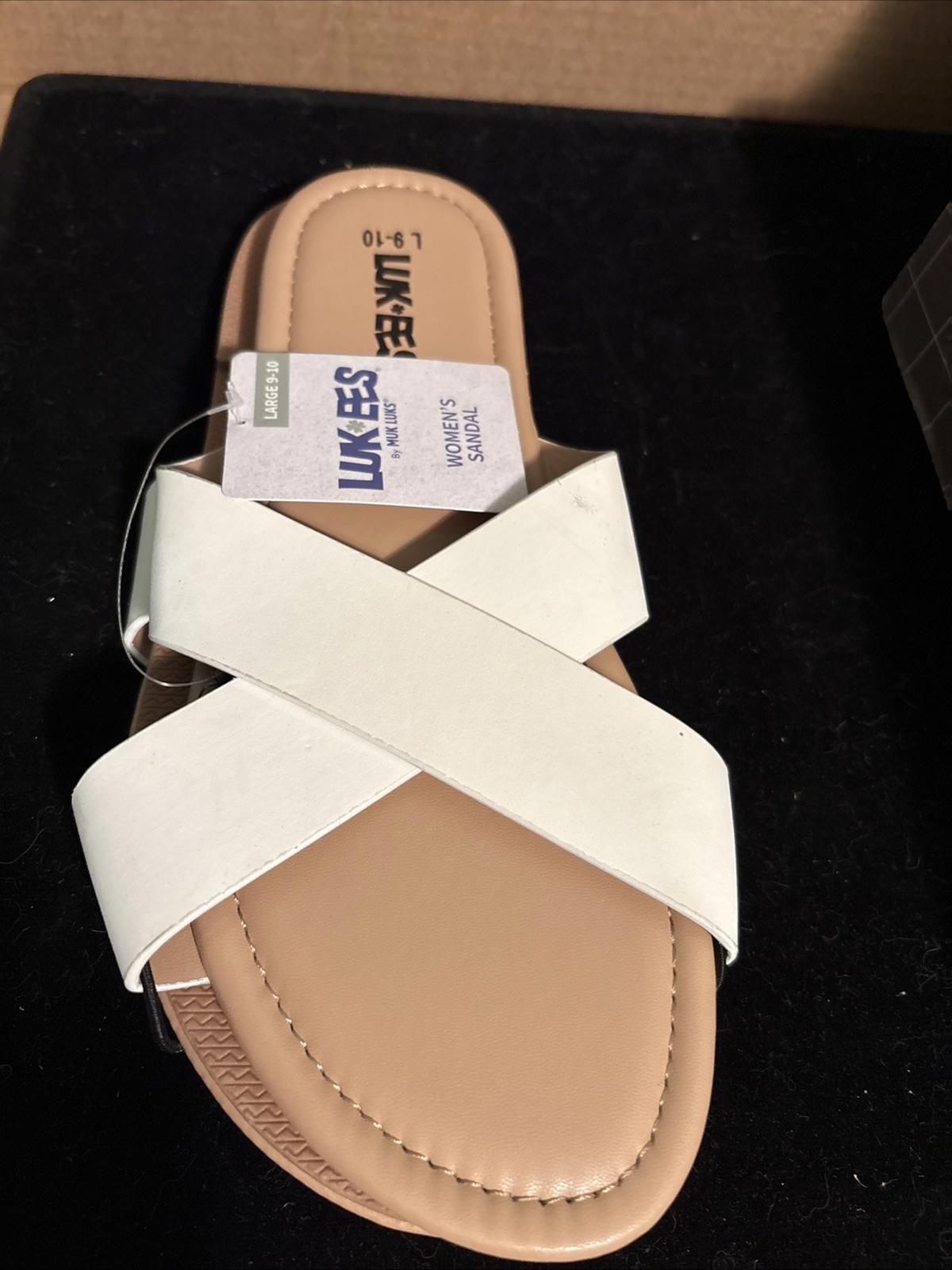 Lukees white cross strap sandals with a comfortable sole and stylish design.