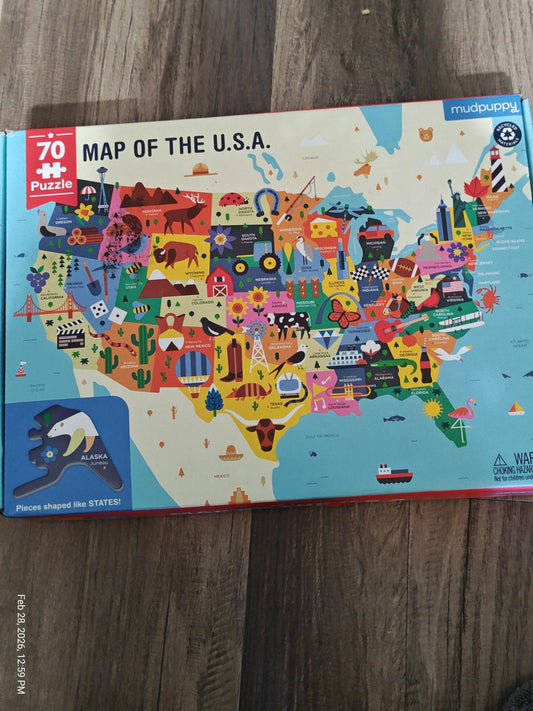 Map of the U.S.A. puzzle featuring colorful illustrations of states and landmarks.