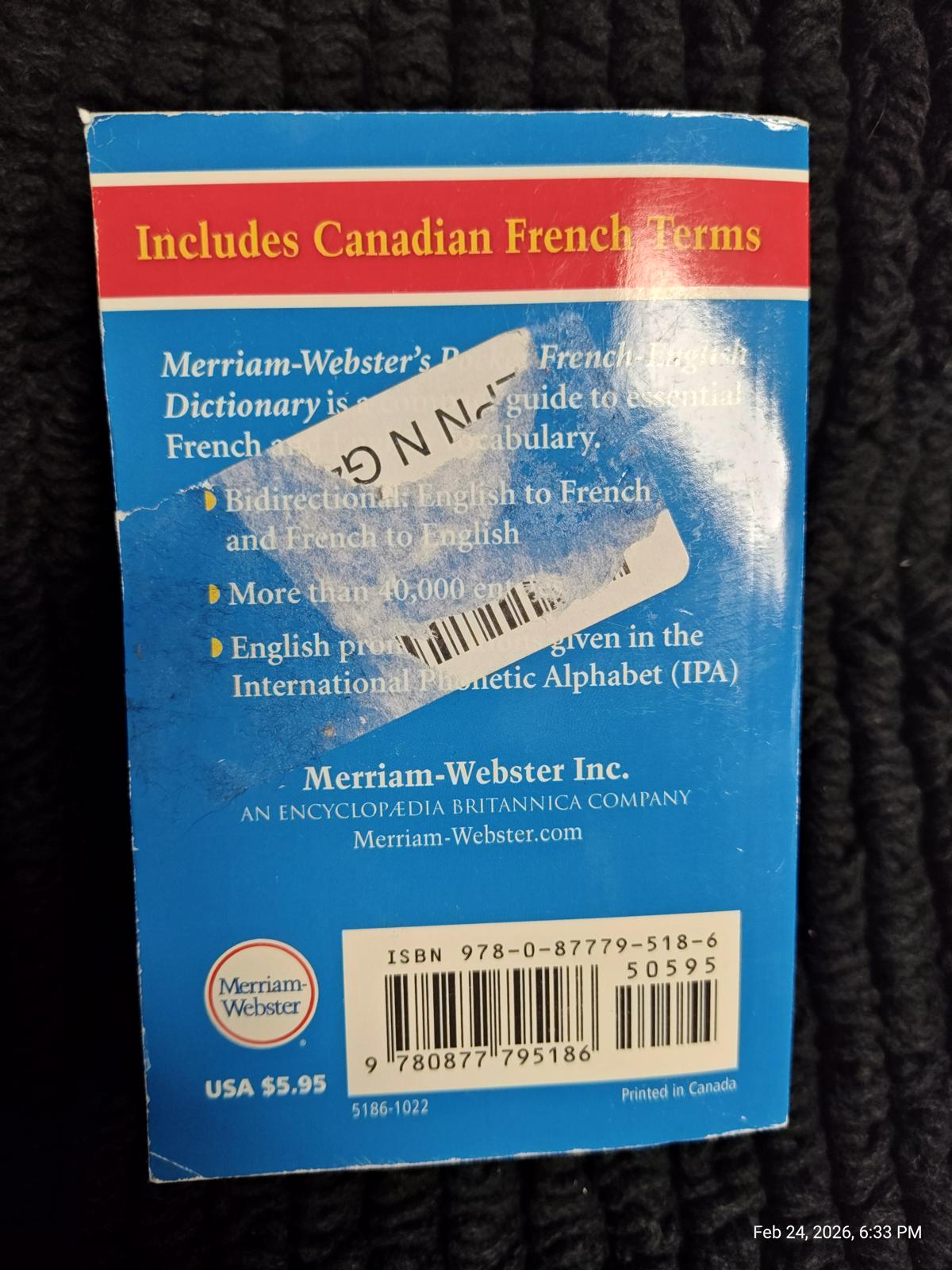 Merriam-Webster's French-English Dictionary cover featuring Canadian French terms and IPA.