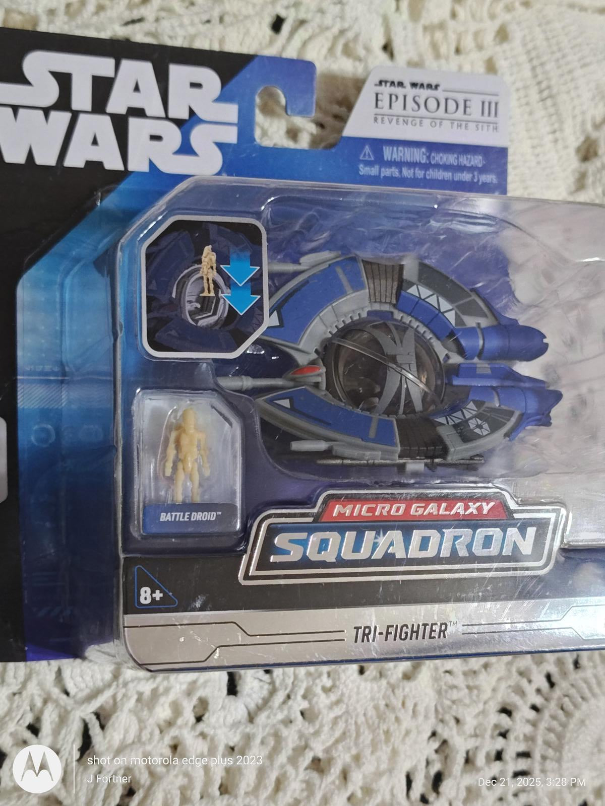 Micro Galaxy Squadron Tri-Fighter toy from Star Wars featuring detailed design and pilot figure.