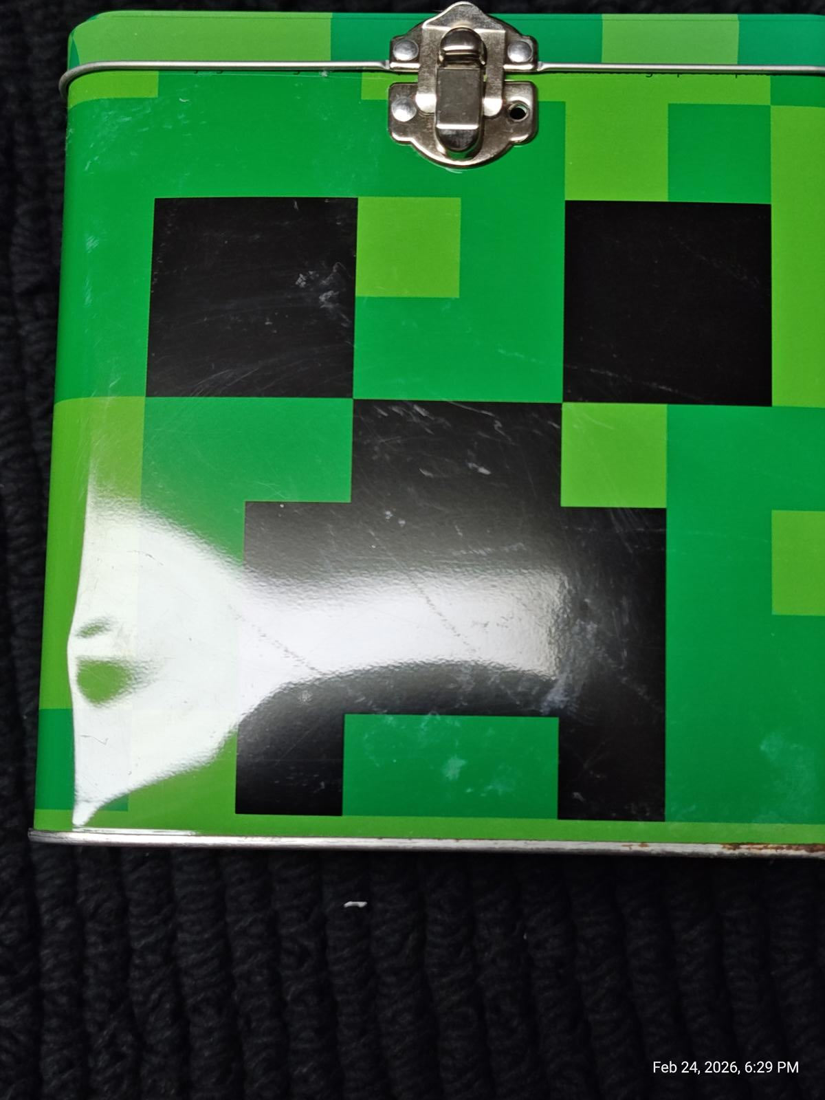 Minecraft Creeper lunchbox featuring a vibrant green and black pixelated design.