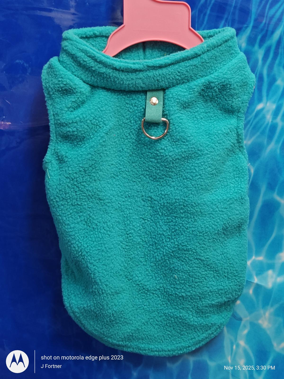 Motorola Edge Plus 2023 teal fleece pet sweater with collar and ring detail.
