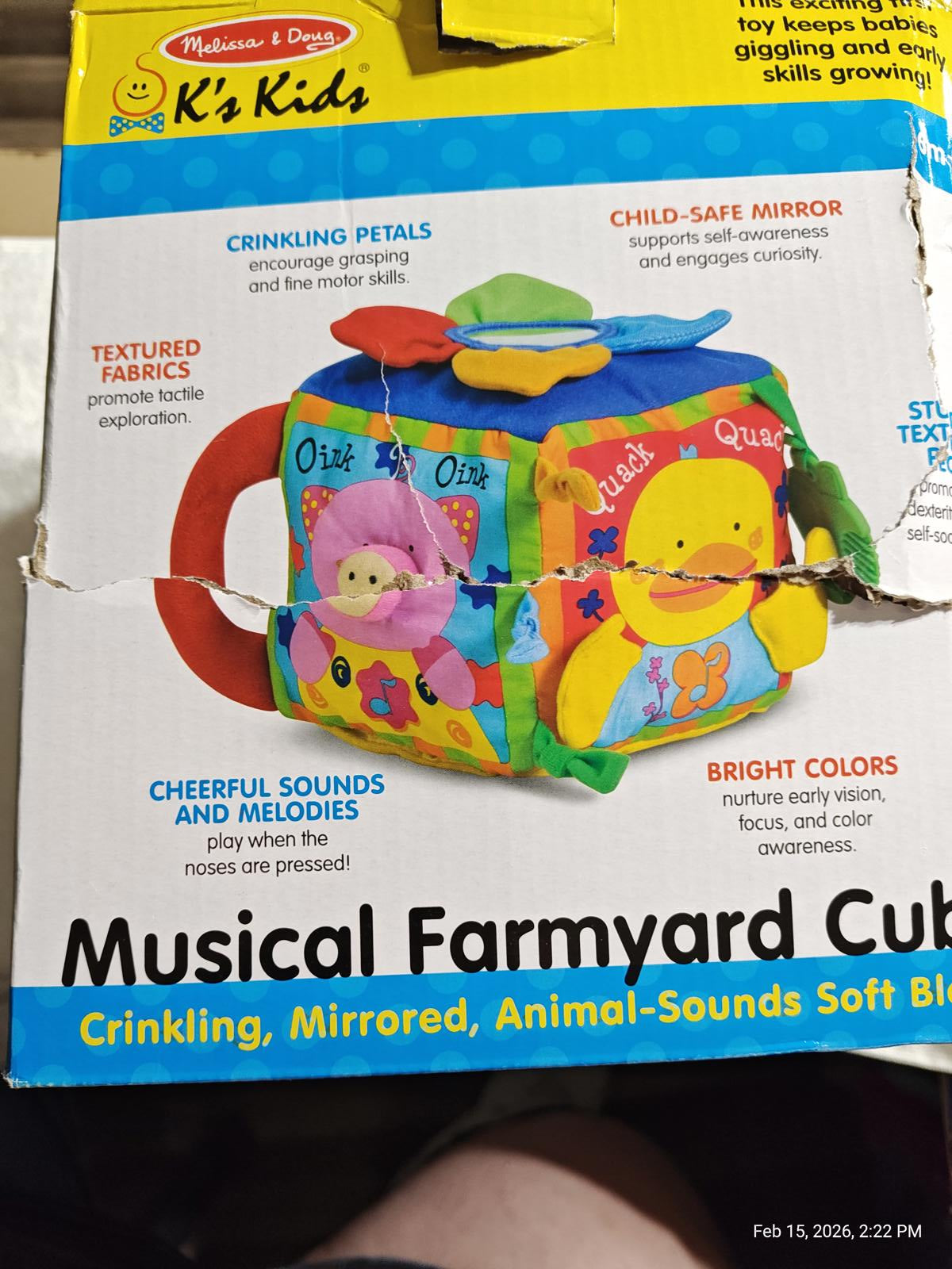 Musical Farmyard Cube features crinkling petals, bright colors, and a child-safe mirror.