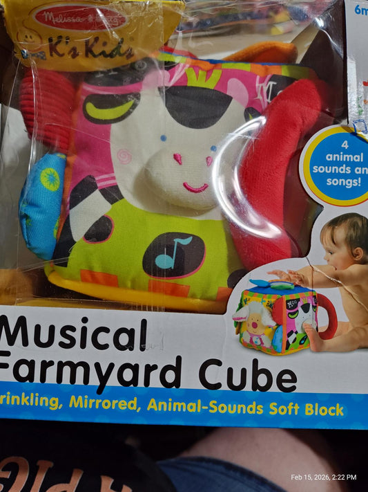 Musical Farmyard Cube features colorful animal designs and soft textures for sensory play.