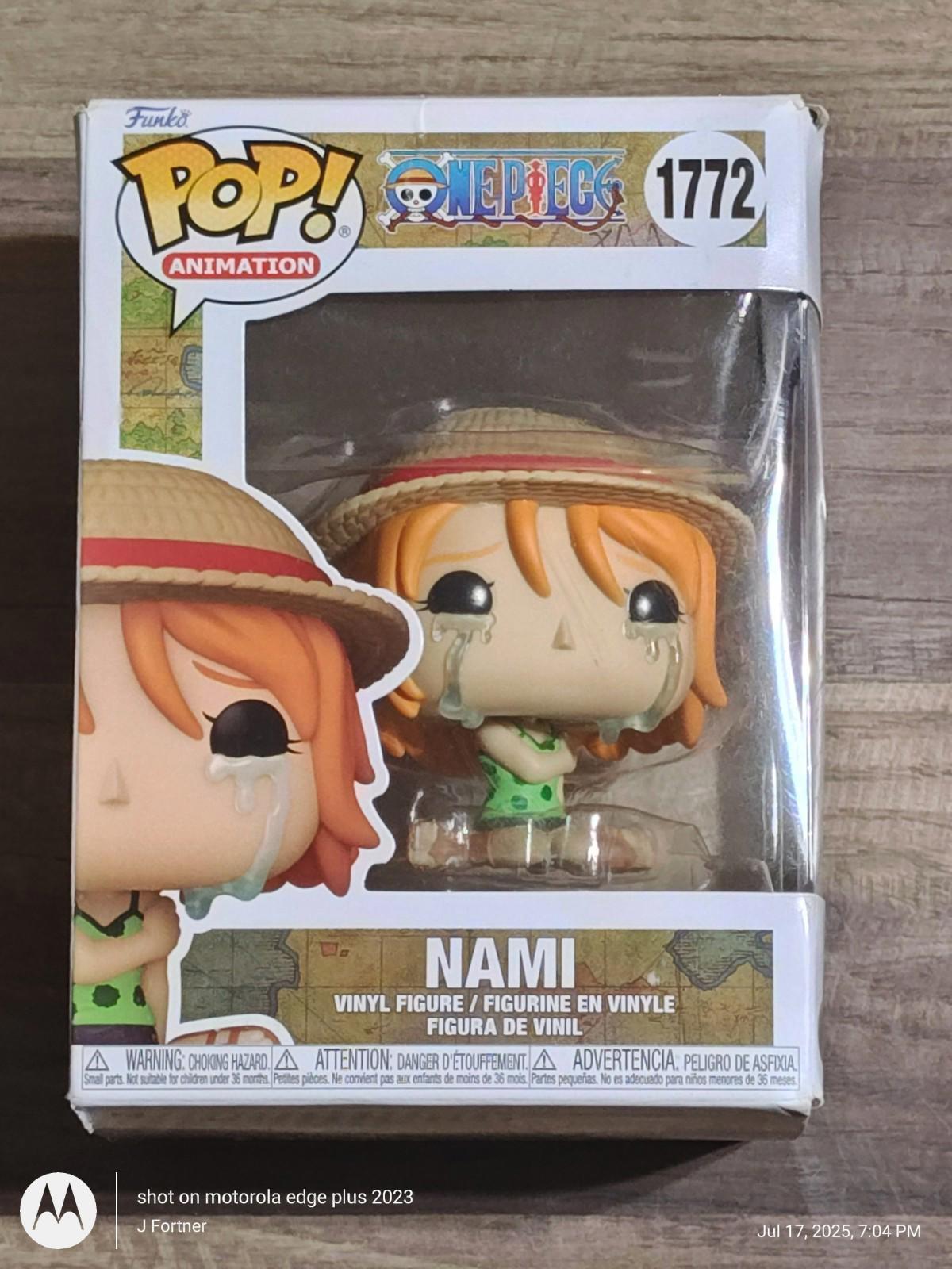 Nami Funko Pop! vinyl figure from One Piece, featuring orange hair and a straw hat.