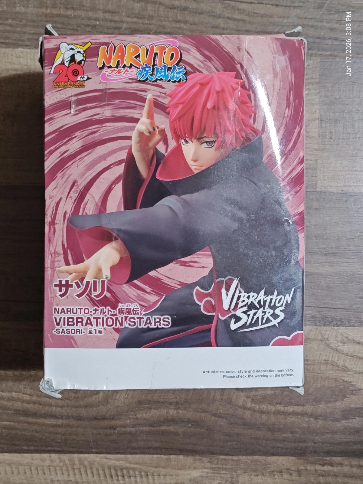 Naruto Vibration Stars figure featuring Sasori in a dynamic pose with red hair.