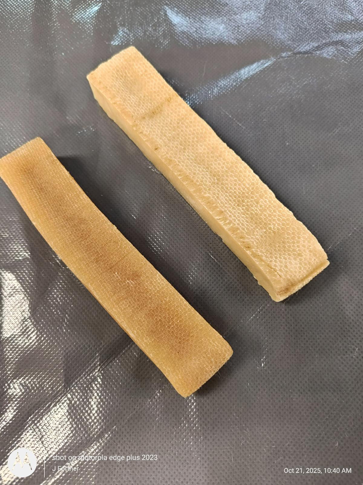 Natural Dog Chew Sticks made from durable material, perfect for keeping dogs entertained.