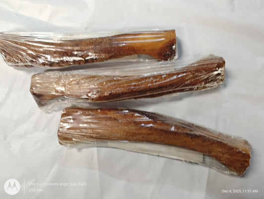 Natural Dog Chews made from high-quality wood, packaged in clear plastic, ideal for chewing.