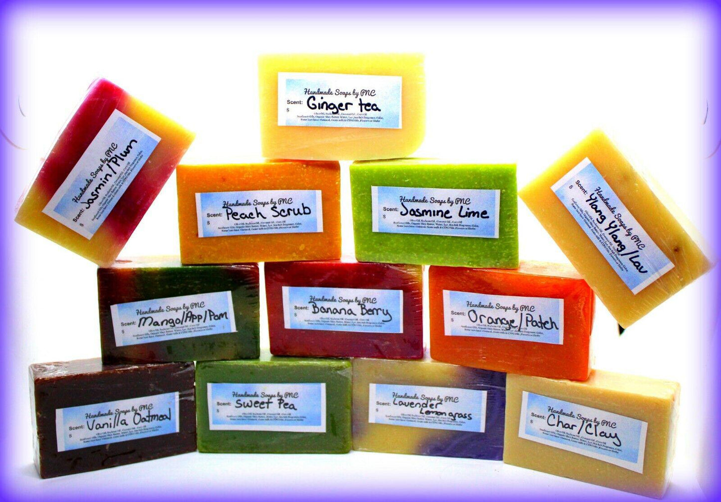 Handmade soap bars in various colors and scents including ginger tea and lemon lime.