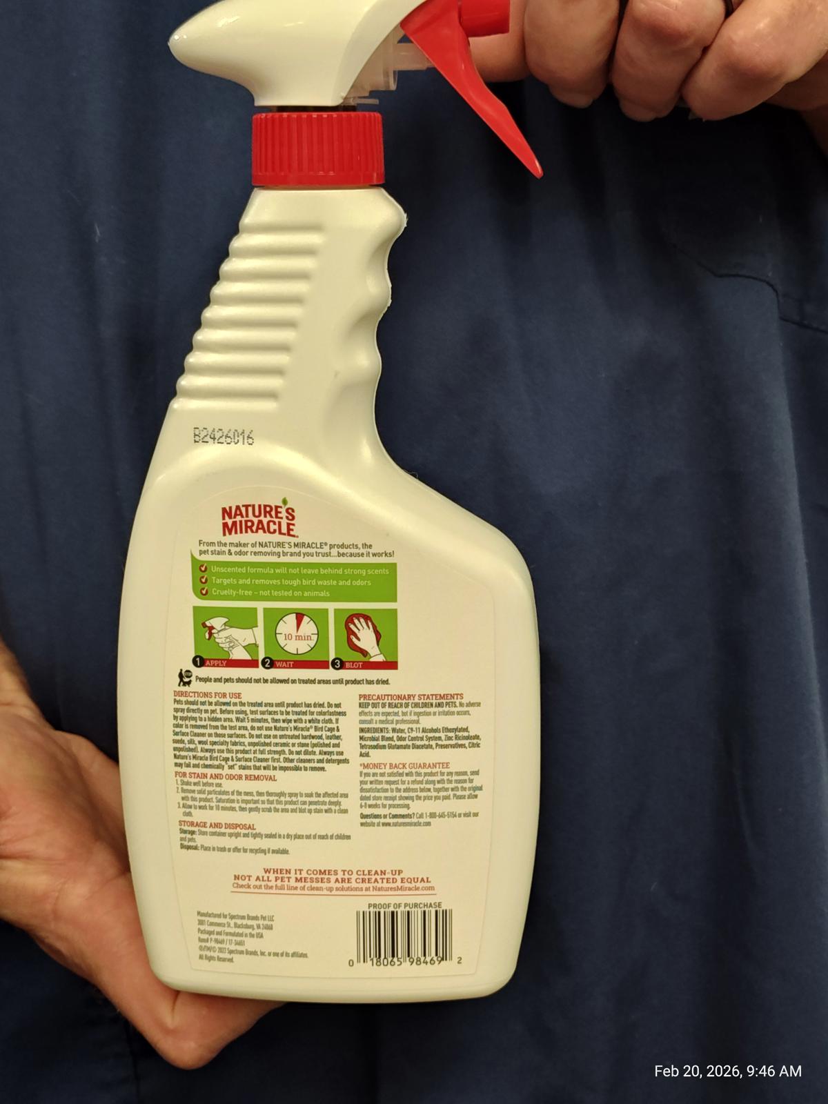 Nature's Miracle stain and odor remover spray bottle with clear instructions on the back.