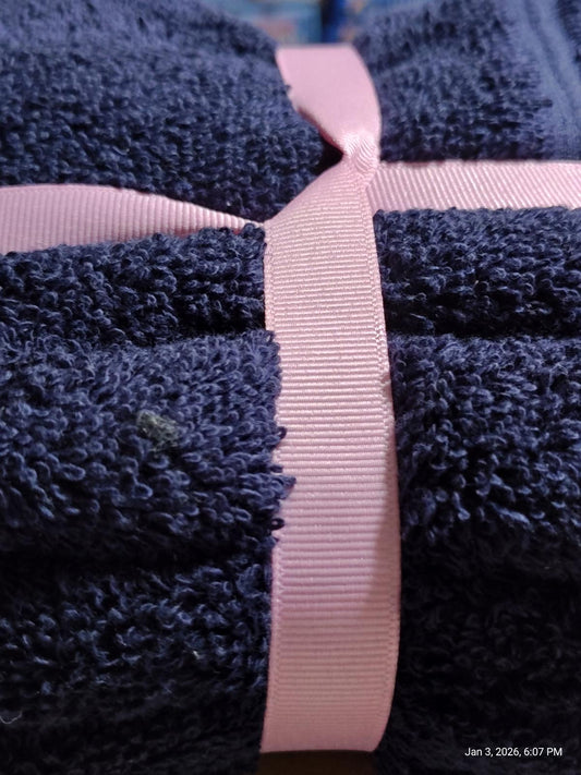 Navy Blue Bath Towel wrapped with a pink ribbon, showcasing its soft texture and plush design.