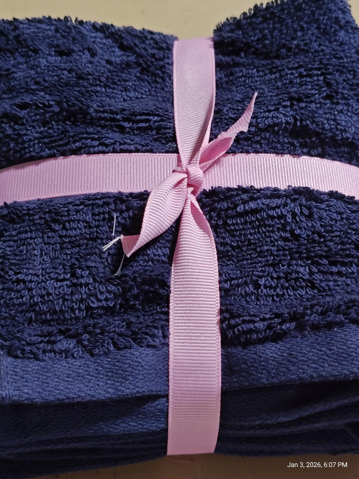 Navy Blue Towel Set wrapped with a pink ribbon, showcasing soft texture and plush design.