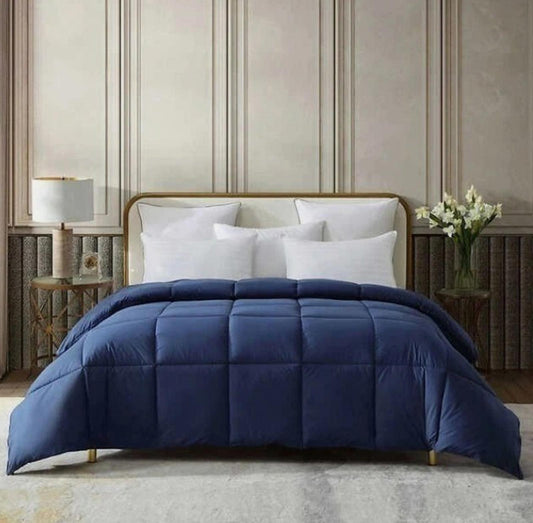 Navy Blue Comforter Set featuring a quilted design on a stylish bed.