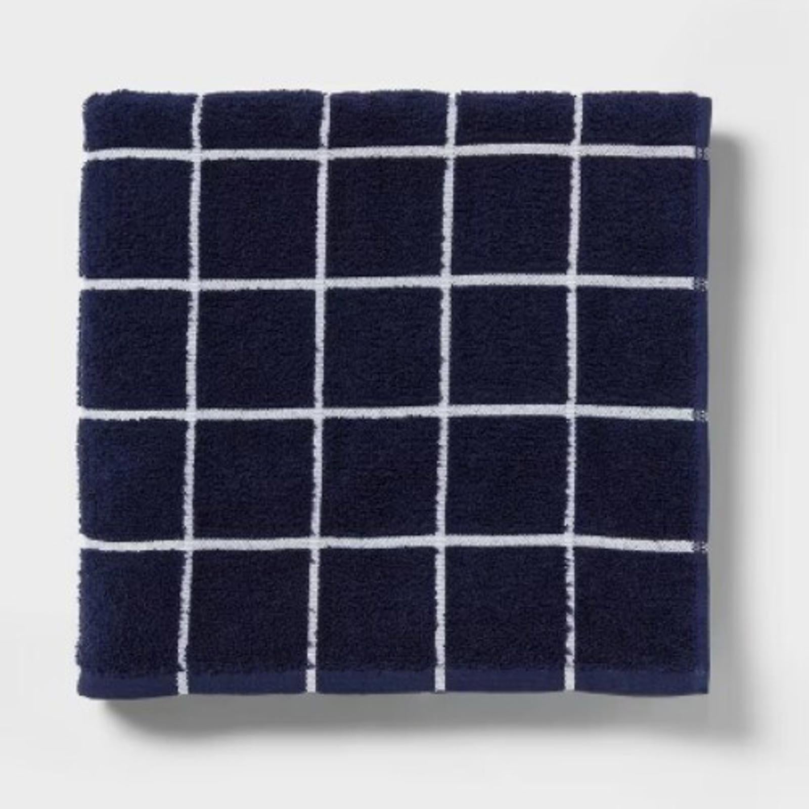 Navy grid-patterned towel with white lines, soft and absorbent fabric.