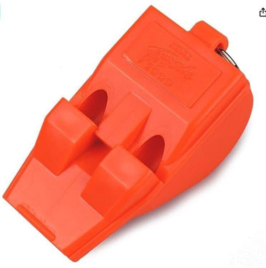 Orange tire chock designed for secure vehicle parking and stability.