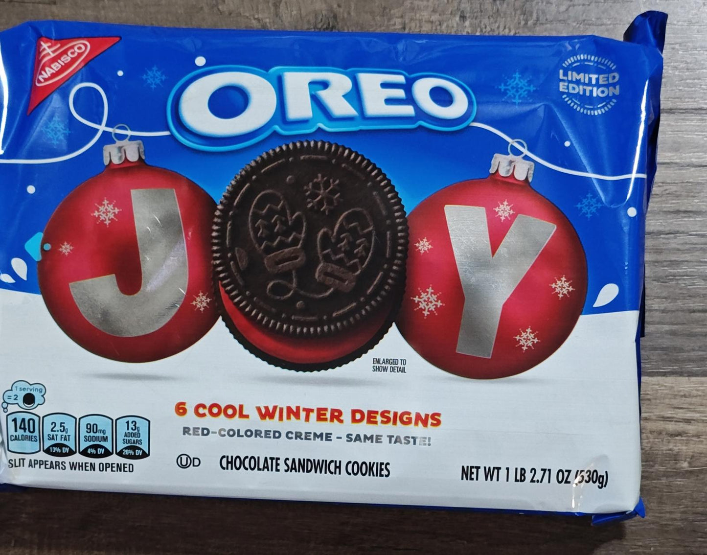 Oreo Joy limited edition cookies featuring red-colored creme and winter designs.