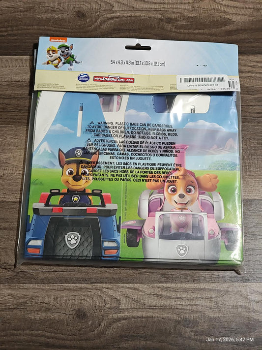 Paw Patrol plastic table cover featuring Chase and Skye in colorful vehicles.