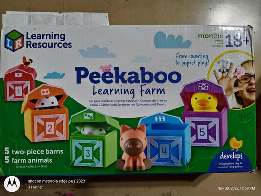 Peekaboo Learning Farm features colorful barns with farm animals for interactive play.