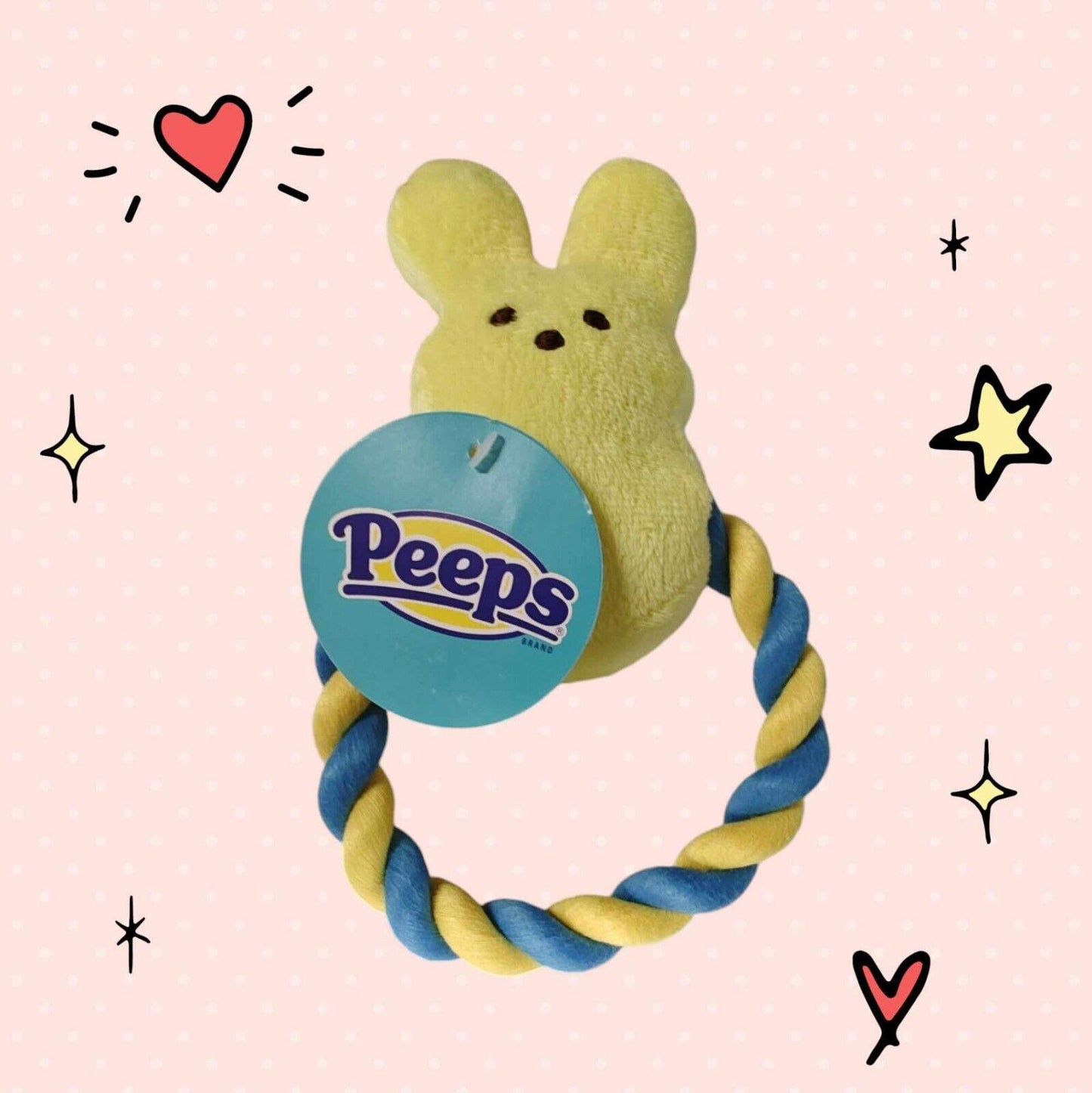 Peeps plush toy with a yellow bunny design and a blue and yellow twisted ring.